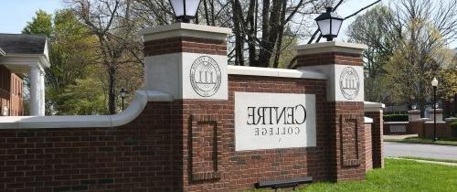 Brick entryway to campus with Centre logo